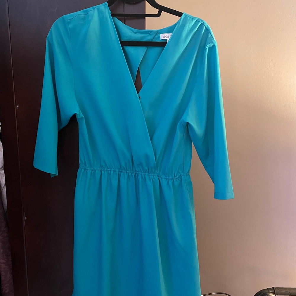 Beautiful turquoise BCBGeneration dress with cut-out back. Only worn once!